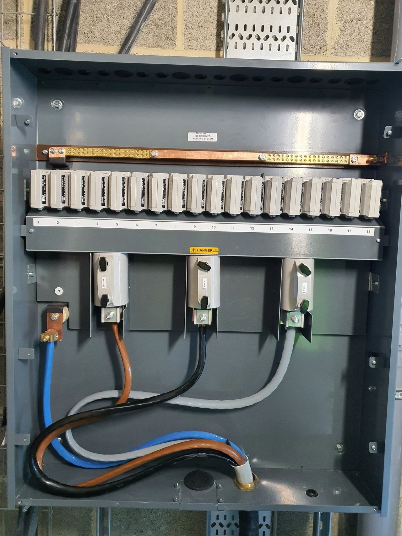 Commercial distribution board with breakers on a copper busbar